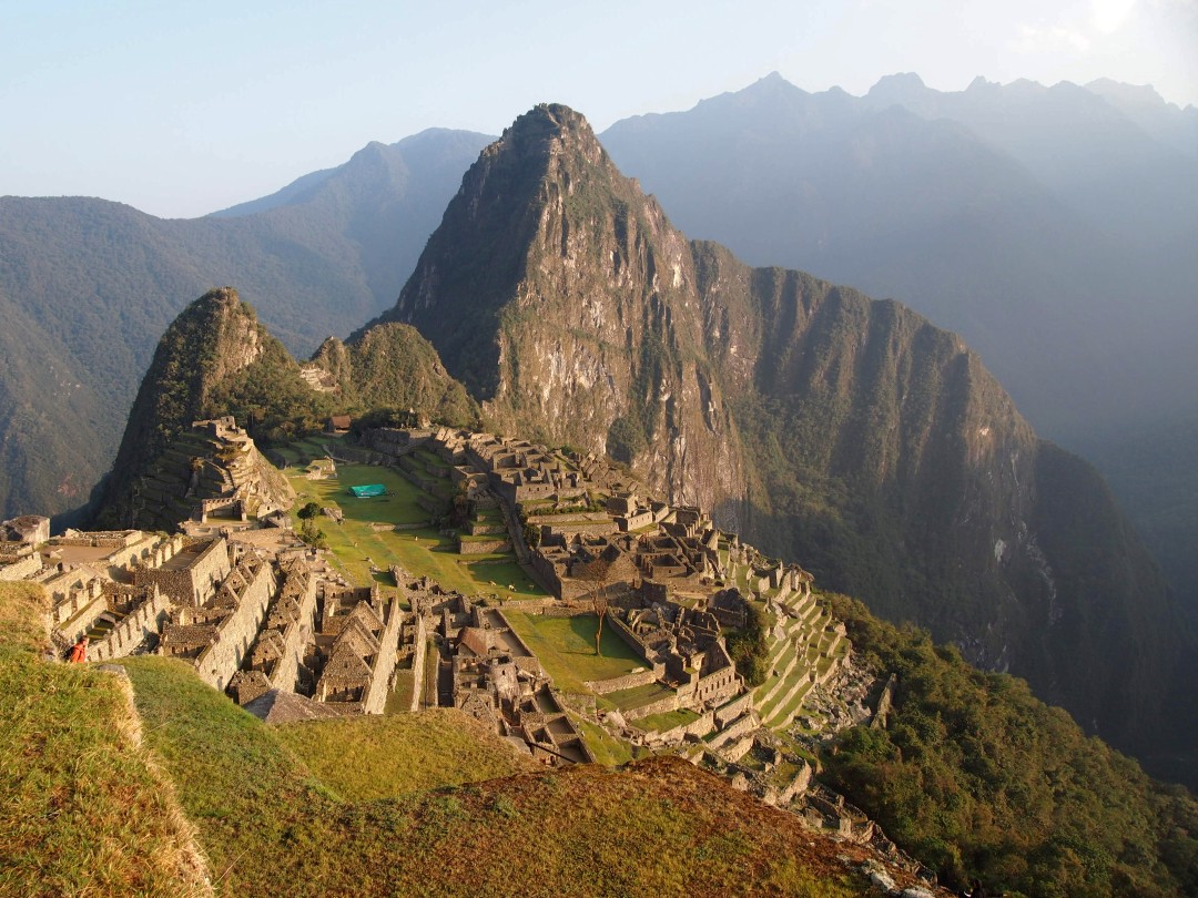 The famous Inka citadel of Machu Picchu in the warm light of the morning sun