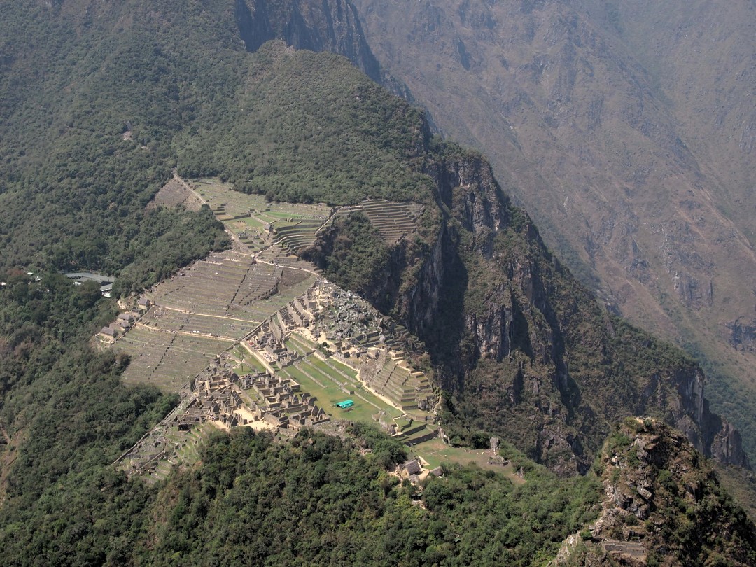 A top view on Machu Picchu on the back of a mountain from far above