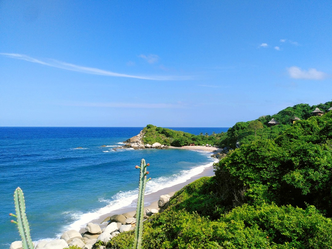 A Caribbean beach with very blue water under a blue sky